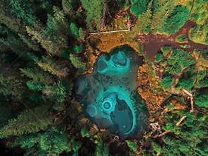 Geyser (blue, silver) lake with thermal springs