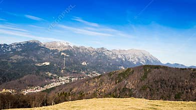 Timelapsed scenery with mountain peaks and cloudy sky