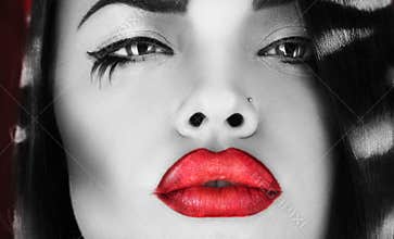 Horizontal photo of black and white female with red lips