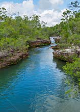 A waterfall flows into a pristine creek in tropical Cape York Peninsula
