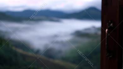 Hand Opening Window to Foggy Mountain with Million dollar view in Nan