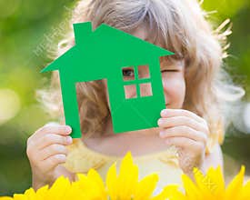 Paper house in hand