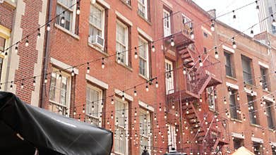 New York City Manhattan building architecture. Red brick house exterior. Real estate property, USA.