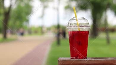 Lemonade in a disposable plastic cup, takeaway drink