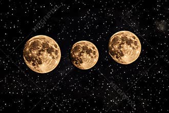 Three full moons shining brightly in a starry night sky