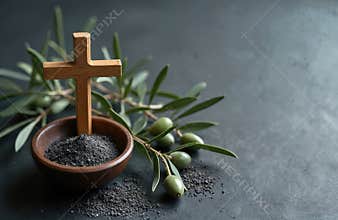 Symbolic Ash Wednesday still life with cross bowl of ash olive branch. Season of lent, time for reflection penance faith.