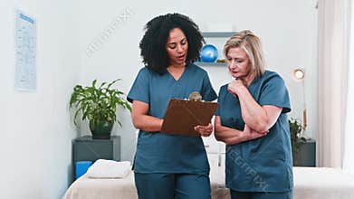 Diverse Women Physiotherapists Engaged in Professional Discussion and Mentorship in a Modern Healthcare Business
