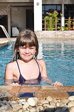 Smiling girl portrait in pool