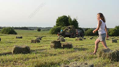 Woman carry bale tractor