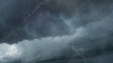 thunderstorm amidst dark clouds and dark sky
