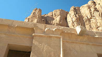 A huge high mountain near an Egyptian temple