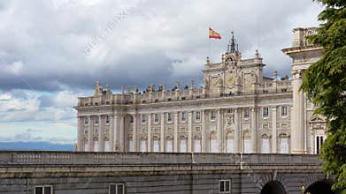 Royal Palace of Madrid under dramatic cloudy sky