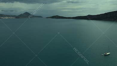 Aerial beach view with luxury yacht at blue sea