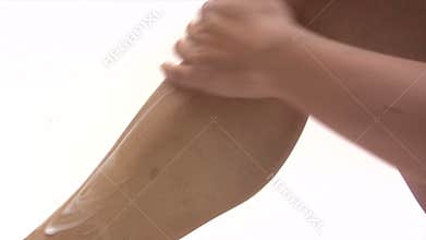 Woman Applying Body Lotion
