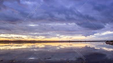 Algarve QDL cloudscape Sunset timelapse at Ria Formosa wetlands reserve, Portugal