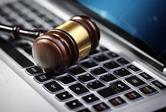 Justice gavel and laptop computer keyboard