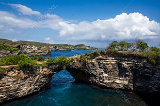 Limestone Coastal Arch Above Vibrant Blue Ocean
