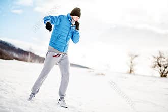 Athlete having a workout out on snow, fitness concept
