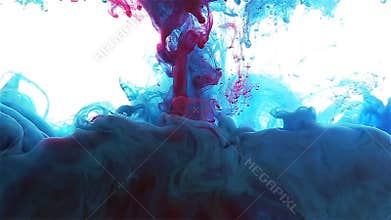 Color ink drop in water. blue, cyan, red color spread