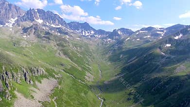 Aerial Kackar Mountains Turkey valley stream and green meadows open across treeless alpine terrain, water, rocks, creek, turkiye
