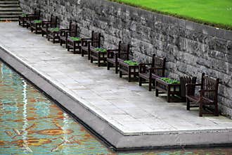 Row of seats near the pool in Garden Of Remembrance,Dublin,Ireland,Fall,2014