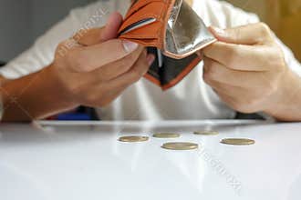 Coin falling from wallet - Little money concept