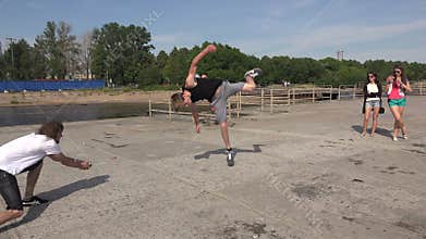 The young man doing somersaults. Salto. 4K.