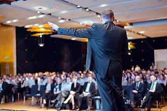 Speaker giving talk at business conference event
