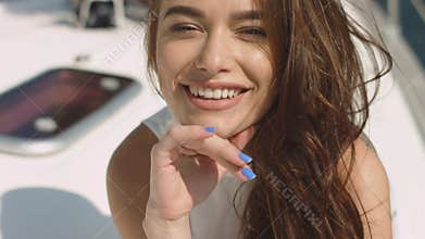 Young brunette girl on the yacht