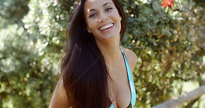 Cheerful Woman in Bikini Bra Smiling at the Camera