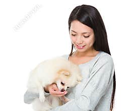 Woman feed her dog