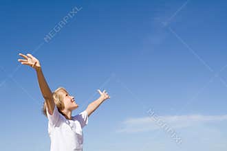 Happy child arms raised