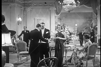 Waiter serving champagne to guests at party