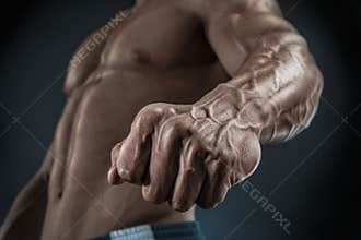 Close-up of athletic muscular arm and torso