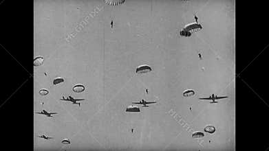 Paratroopers jumping from plane, 1940s