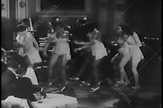 Tap dancers performing in nightclub, 1930s