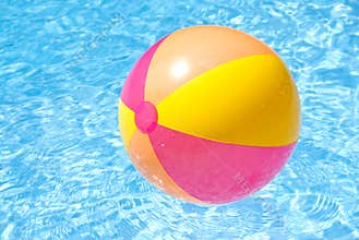 Beach Ball Floating in the Pool