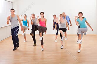 Group of people doing aerobics exercises