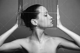 Surrealistic woman with cage