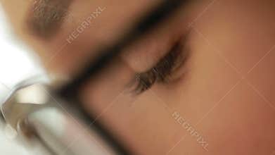 Close-up shot of woman's eyes in glasses. Young woman with glasses.