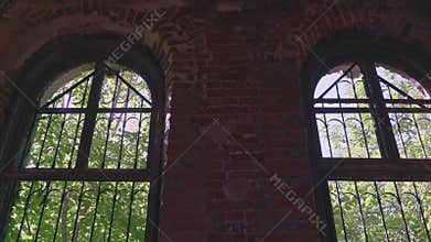 Indoor view to the outdoor forest via old ruined window