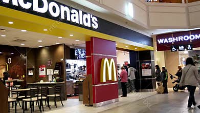 Motion of people line up for ordering food at mcdonalds check out counter