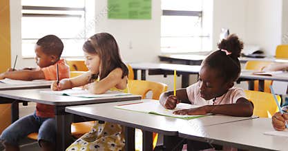 School kids studying in classroom