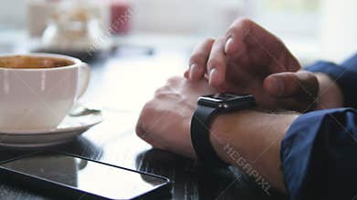 Modern smartwatch used on a mans hand. Hi-tech device concept. 4K.