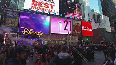 New York, USA Crowd by advertising billboards at Times Square.