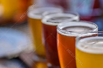 Closeup macro of a beer flight in sunlight