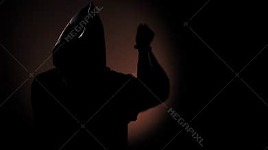 Grim girl in a ritual wardrobe with a knife in a dark
