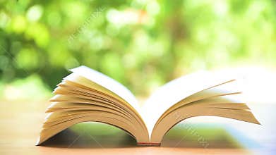 Book`s pages turning by wind.