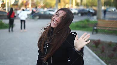 Pretty urban girl waving hand saying hello and hi gesture