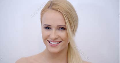 Smiling Face of Blond Woman Looking at Camera